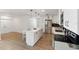 Open floorplan kitchen with island, stainless appliances, modern lighting at 609 Glen Oak Rd, Venice, FL 34293