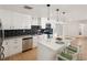 Modern kitchen with quartz countertops, stainless appliances, and tile backsplash at 609 Glen Oak Rd, Venice, FL 34293