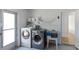 Bright laundry area includes modern washer and dryer, utility sink, and convenient shelving at 609 Glen Oak Rd, Venice, FL 34293