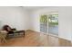 Bright living room with wood floors and sliding glass doors leading to patio at 609 Glen Oak Rd, Venice, FL 34293