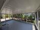 Large screened porch overlooking professionally landscaped yard, perfect for enjoying the outdoors bug-free at 609 Glen Oak Rd, Venice, FL 34293