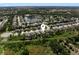 Aerial shot showcases the home's location in a residential community with lake views at 6124 35Th E Ct, Bradenton, FL 34203