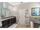 Bathroom featuring a bathtub, vanity with granite countertop, and decorative towel rack at 6124 35Th E Ct, Bradenton, FL 34203