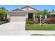 Inviting single-Gathering home with manicured lawn, stone accents, and a two-car garage at 6124 35Th E Ct, Bradenton, FL 34203