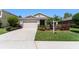 Charming single-story home with a well-manicured lawn and a two-car garage at 6124 35Th E Ct, Bradenton, FL 34203