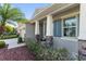Charming home featuring a covered front porch with stone accents and colorful shutters at 6124 35Th E Ct, Bradenton, FL 34203