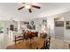 Open living space with dining table, neutral walls and plenty of natural light at 6124 35Th E Ct, Bradenton, FL 34203
