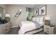 Cozy bedroom with large window, white bedding, neutral decor, and stylish accents, creating a comfortable retreat at 6908 Prairie Oak Way, Nokomis, FL 34275