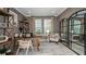 Home office with a large desk, shelving, and natural light, perfect for working from home at 6908 Prairie Oak Way, Nokomis, FL 34275