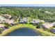 Aerial view of the houses showcasing waterfront properties with lush landscaping and serene surroundings at 7034 Honeysuckle Trl, Lakewood Ranch, FL 34202