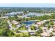 Aerial view of a beautiful neighborhood with stunning lake views and luxurious homes surrounded by lush greenery at 7034 Honeysuckle Trl, Lakewood Ranch, FL 34202