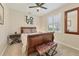 Cozy bedroom with a wooden sleigh bed, neutral walls, and a window with plantation shutters at 7034 Honeysuckle Trl, Lakewood Ranch, FL 34202