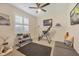 Versatile bedroom with exercise equipment, neutral paint, and a window with privacy blinds at 7034 Honeysuckle Trl, Lakewood Ranch, FL 34202