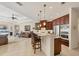 Open kitchen featuring barstool seating at the island and stainless steel appliances at 7034 Honeysuckle Trl, Lakewood Ranch, FL 34202