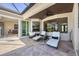 Relaxing screened lanai with lounge chairs, views, and an interior access to the home at 7034 Honeysuckle Trl, Lakewood Ranch, FL 34202