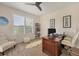 Bright office featuring a modern desk, a comfortable chair, and a window view at 7034 Honeysuckle Trl, Lakewood Ranch, FL 34202