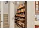 Walk-in pantry with shelving for organized storage of food and household items at 7034 Honeysuckle Trl, Lakewood Ranch, FL 34202