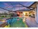 Beautiful screened pool with a spa and a covered lanai area perfect for relaxing and entertaining at 7034 Honeysuckle Trl, Lakewood Ranch, FL 34202