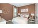 Comfortable bedroom with playful decor and plenty of natural light at 7048 Foxboro Way, Nokomis, FL 34275