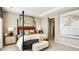 Elegant primary bedroom with a tray ceiling, and a serene and stylish ambiance at 7048 Foxboro Way, Nokomis, FL 34275