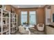Bright, stylish home office space with ample natural light and modern decor at 7048 Foxboro Way, Nokomis, FL 34275