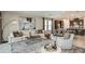 Open-concept living room and kitchen combination perfect for entertaining and modern living at 7052 Foxboro Way, Nokomis, FL 34275