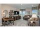 Upstairs bonus room with modern decor featuring comfortable seating, and desk area at 7052 Foxboro Way, Nokomis, FL 34275
