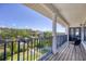 Balcony featuring metal railing and white pillars, overlooking a water view at 7142 Hawks Harbor Cir, Bradenton, FL 34207