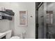 Modern bathroom features a glass-enclosed shower with a rain showerhead and sleek black hardware at 7142 Hawks Harbor Cir, Bradenton, FL 34207