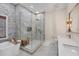 Modern bathroom features a luxurious soaking tub, glass-enclosed shower, and double-sink vanity at 7142 Hawks Harbor Cir, Bradenton, FL 34207