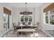 Dining room featuring a modern chandelier and large window overlooking the backyard at 7142 Hawks Harbor Cir, Bradenton, FL 34207