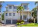 Beautiful two-story home featuring a well-manicured lawn and a two-car garage, blending style with comfortable living at 7142 Hawks Harbor Cir, Bradenton, FL 34207