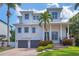 Stunning two-story home with a meticulously landscaped front yard and a two-car garage at 7142 Hawks Harbor Cir, Bradenton, FL 34207
