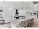 Bright kitchen with white cabinetry, stainless steel appliances, and large island with seating at 7142 Hawks Harbor Cir, Bradenton, FL 34207