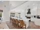 Bright, open kitchen features a large central island with seating and modern stainless steel appliances at 7142 Hawks Harbor Cir, Bradenton, FL 34207
