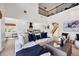 Open-concept living space with soaring ceilings, showcasing seamless transition to the adjacent kitchen and staircase at 7142 Hawks Harbor Cir, Bradenton, FL 34207
