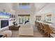 Spacious living room with fireplace, open floor plan, and bar seating at 7142 Hawks Harbor Cir, Bradenton, FL 34207
