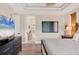 Relaxing main bedroom leads into the en-suite bathroom, complete with modern decor and spacious layout at 7142 Hawks Harbor Cir, Bradenton, FL 34207