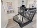Staircase with dark rails and light colored wooden stairs leading to the second floor at 7142 Hawks Harbor Cir, Bradenton, FL 34207