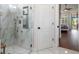 Updated bathroom featuring a walk-in shower with a white marble tile at 9422 Hawksmoor Ln, Sarasota, FL 34238