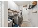 A functional laundry room with modern appliances and plenty of storage space at 9422 Hawksmoor Ln, Sarasota, FL 34238