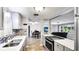 Updated kitchen featuring modern appliances, sleek countertops, and an eye-catching tile backsplash at 959 Cumberland Rd, Venice, FL 34293
