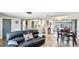 Inviting living room and dining area showcasing an open floor plan, wood flooring, and neutral walls at 959 Cumberland Rd, Venice, FL 34293