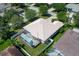 Aerial view of a private home featuring a screened in pool and fenced in backyard at 11458 30Th E Cv, Parrish, FL 34219