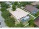 An aerial view of the home showcasing the backyard pool and well-maintained landscaping at 11458 30Th E Cv, Parrish, FL 34219