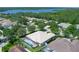 A beautiful aerial view of a home with a screened in pool and lush landscaping at 11458 30Th E Cv, Parrish, FL 34219