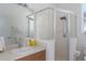 Bright bathroom featuring a glass-enclosed shower and neutral-toned vanity at 11458 30Th E Cv, Parrish, FL 34219