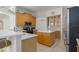 Bright kitchen featuring stainless steel appliances, center island with breakfast bar, and ample cabinet space at 11458 30Th E Cv, Parrish, FL 34219