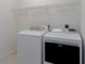 Well-equipped laundry room with modern washer and dryer units at 11458 30Th E Cv, Parrish, FL 34219