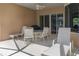 Comfortable covered patio with a seating area, perfect for outdoor dining at 11458 30Th E Cv, Parrish, FL 34219